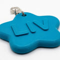 Personalized Name Keychain, a flat one-piece keychain with a sample name (ai-placeholder-replace-with-real-photo)