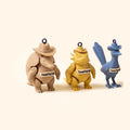 Three Texas Toy Lab crew minis: an armadillo, a horned lizard and a roadrunner in cowboy hats